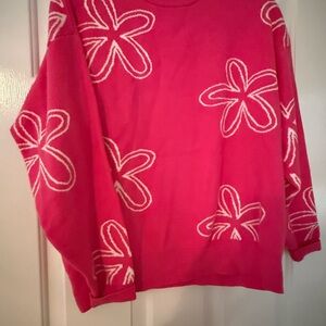 Pink Sweater with White Floral Design